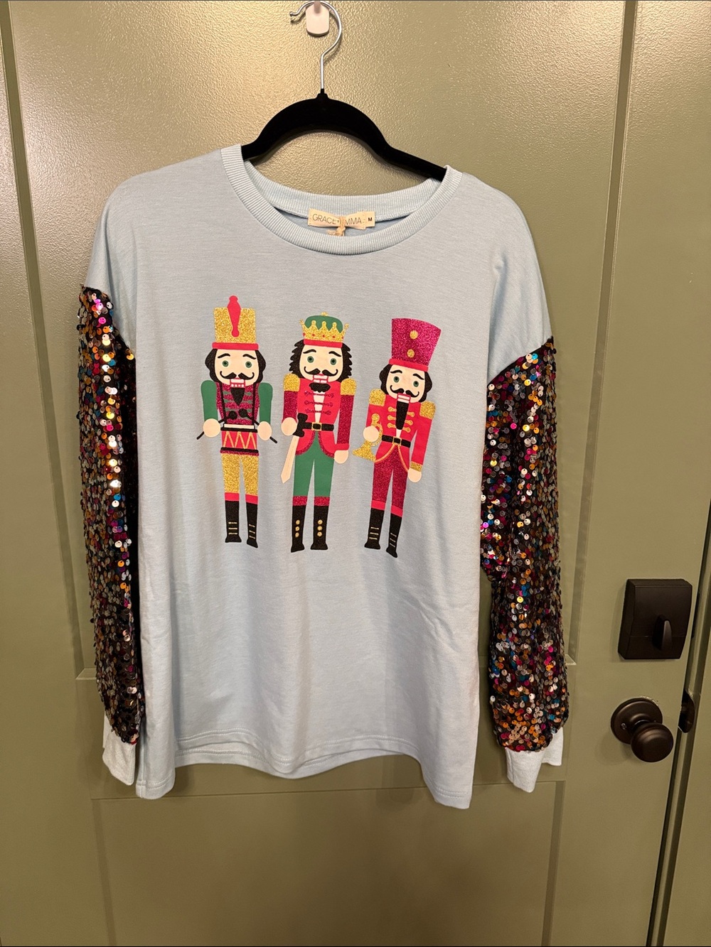 NEW….. GRACE + EMMA Light Blue Nutcracker Sequin Sleeve Tee
